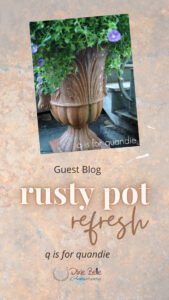 A photo of a brown planter pot sitting on a cement ground with greenery and purple flowers coming out of the top. The background behind the photo is brown rust, and the words Guest Blog rusty pot refresh q is for quandie Dixie Belle 10th Anniversary are printed below the photo.