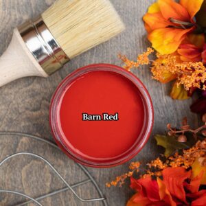 View of open container of Red chalk paint with a natural bristle brush which is the best brush for chalk paint.