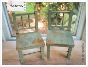 "Before" photo of chairs - blue painted with chips of paint missing, sitting on a brown wooden floor in front of a window