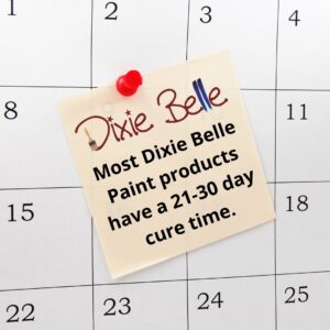 A white calendar with a piece of tan paper thumbtacked to it that reads Most Dixie Belle Paint products have a 21-30 day cure time.